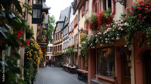 A charming corner of the old city of Mainz, with its traditional German architecture, flower-adorned balconies, and lively street scenes.