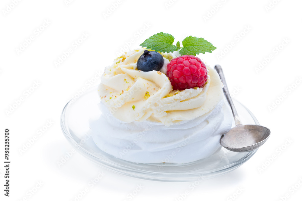 Mini Pavlova meringue nest with berries and whipped cream isolated on white Mini Pavlova meringue nest with berries and whipped cream isolated on white
