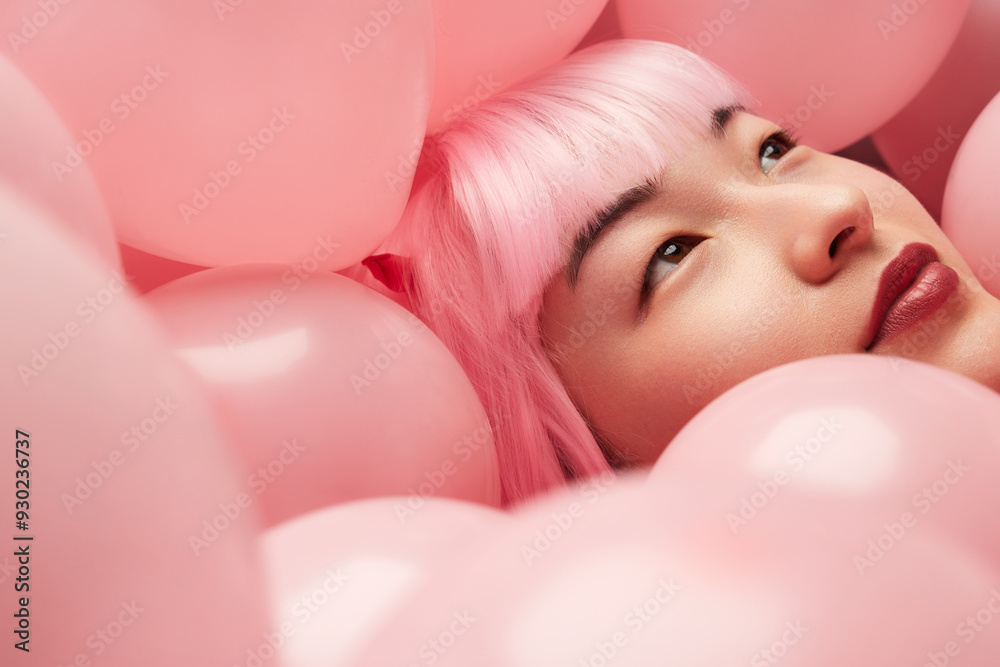 A serene portrait of a woman with pink hair surrounded by pink balloons, evoking beauty and tranquility. A serene portrait of a woman with pink hair surrounded by pink balloons, evoking beauty and tranquility.