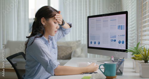 Fotografie Asia people young lady remote workforce work on leave day got bad cold flu covid cough blow running nose on tissue paper sit on desk at home office