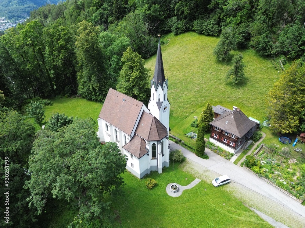 Aerial view of Kuratienkirche Meschach surrounded by lush greenery. Gotzis, Austria Aerial view of Kuratienkirche Meschach surrounded by lush greenery. Gotzis, Austria