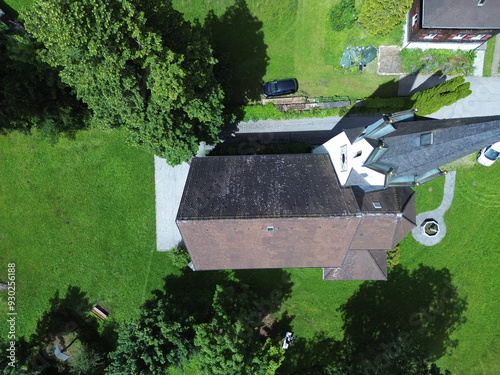 Aerial view of Kuratienkirche Meschach surrounded by lush greenery. Gotzis, Austria photo