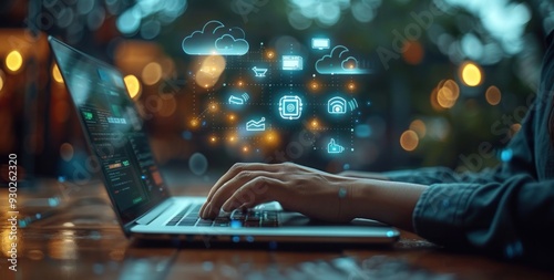 Person Using Laptop with Holographic Icons