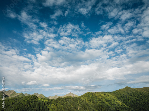 Canvas Print Beautiful cloudy sky over forest mountains