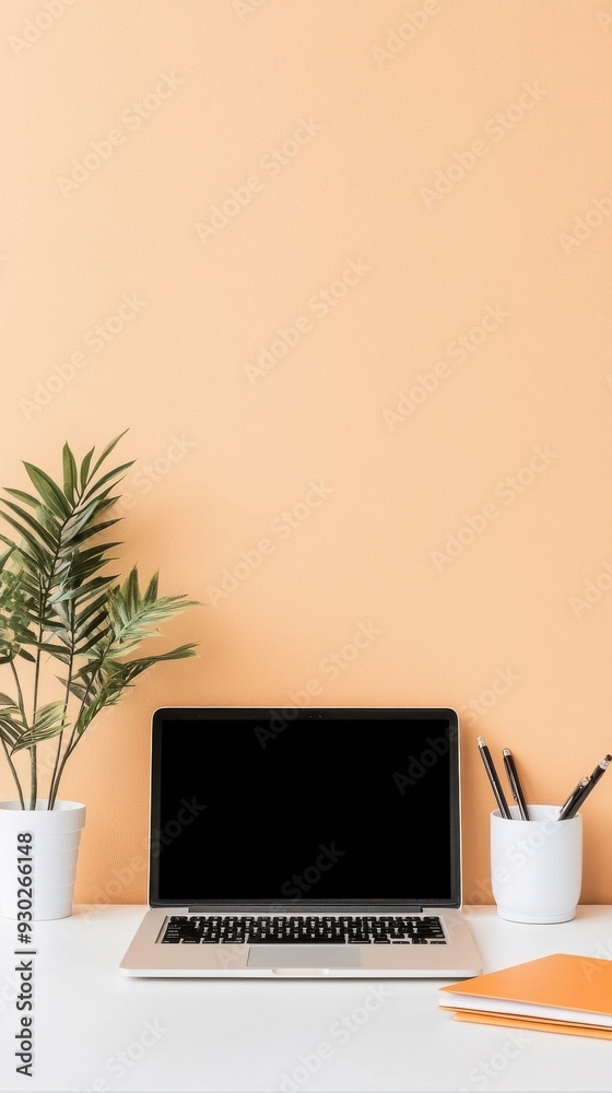 A minimalist desk setup with a laptop, notebook, and potted plant, symbolizing productivity and organization A minimalist desk setup with a laptop, notebook, and potted plant, symbolizing productivity and organization