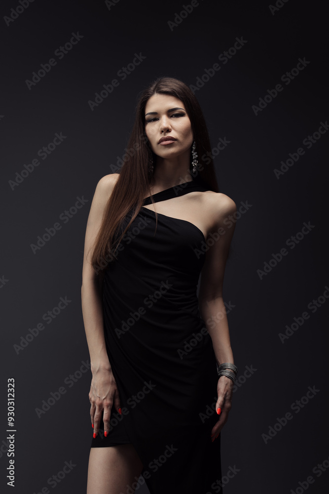 A stylish woman in a sophisticated black dress and chic accessories strikes a confident pose. Embodies class, elegance, and fashion. A stylish woman in a sophisticated black dress and chic accessories strikes a confident pose. Embodies class, elegance, and fashion.