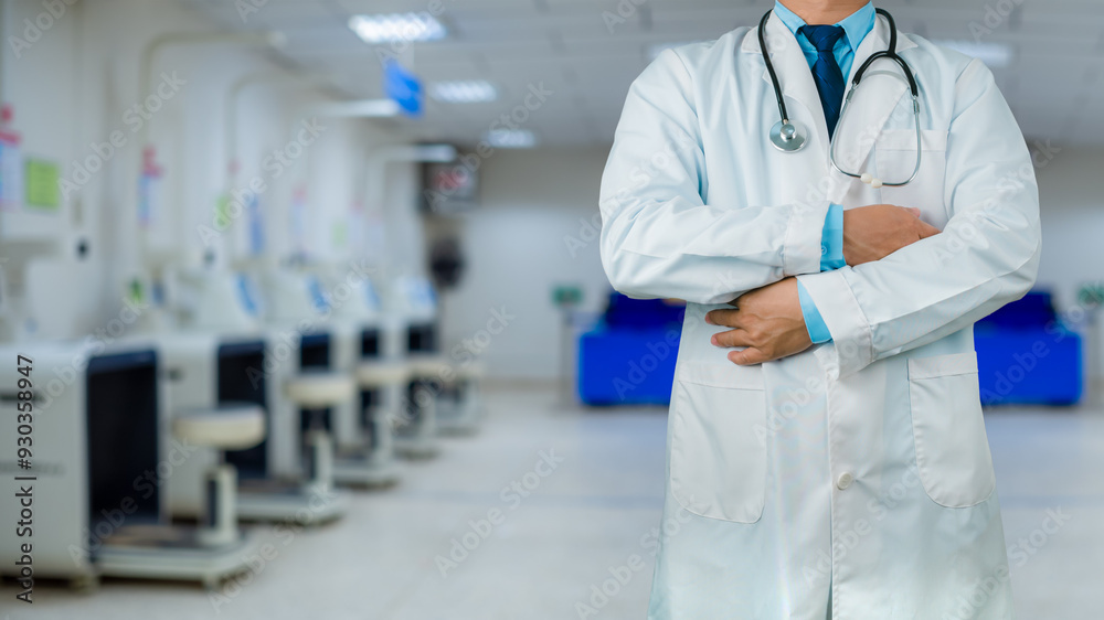 Doctor in a lab coat is standing on the background inside a hospital, Medical concept, Medical information search, Concept of treating disease. Insurance concept, Concept for commercial business. Doctor in a lab coat is standing on the background inside a hospital, Medical concept, Medical information search, Concept of treating disease. Insurance concept, Concept for commercial business.