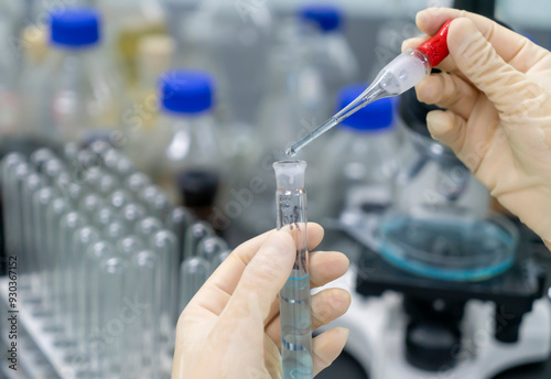 In the chemistry lab, scientists are doing chemical experiments with test tubes