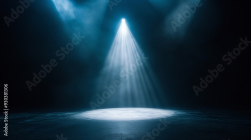 Dimly lit stage background with a bright spotlight