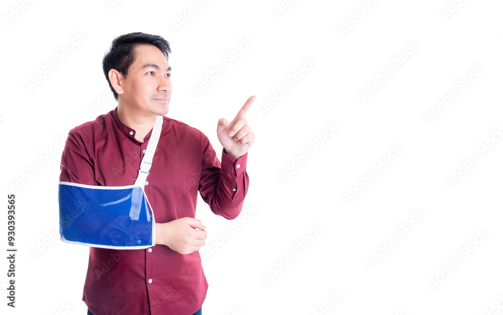 Injured Man with arm in a blue sling points forward with a focused expression, wearing a red shirt. image suggests direction, guidance, or decision-making despite an injury, against a white background Injured Man with arm in a blue sling points forward with a focused expression, wearing a red shirt. image suggests direction, guidance, or decision-making despite an injury, against a white background