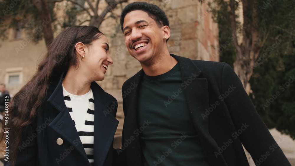 Stylish young couple posing in front of historic cathedral facade, showcasing urban fashion and togetherness Stylish young couple posing in front of historic cathedral facade, showcasing urban fashion and togetherness