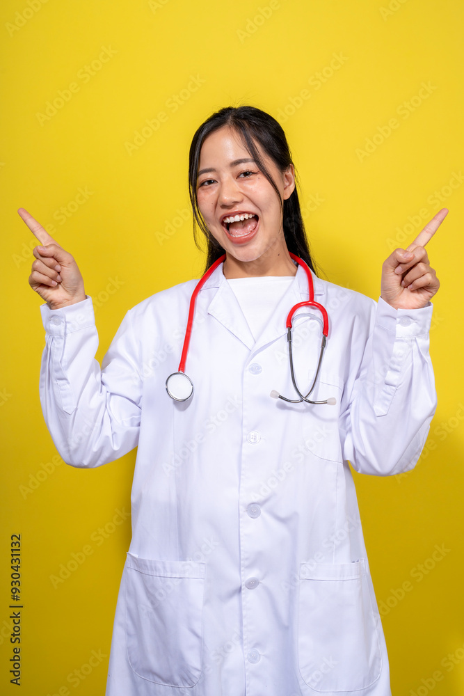 A woman in a white lab coat is pointing to the sky A woman in a white lab coat is pointing to the sky