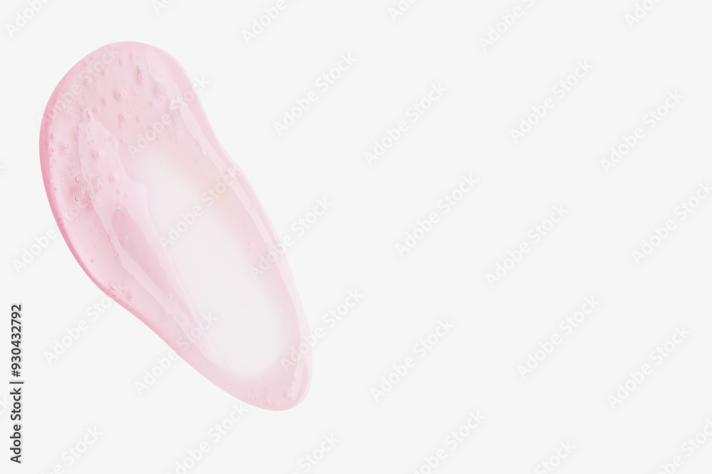 A smear of pink transparent gel on a light background. A smear of pink transparent gel on a light background.