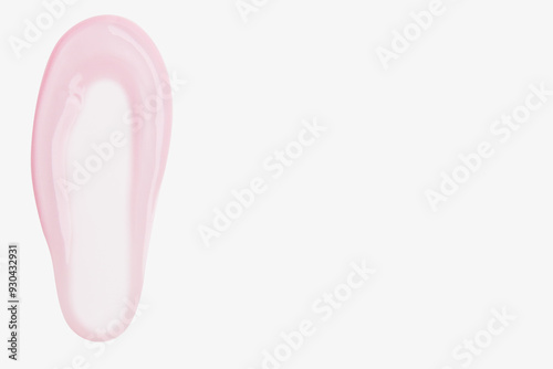 A smear of pink transparent gel on a light background.