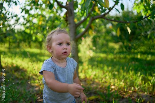 toddler screams and cries in front of family on picnic in garden