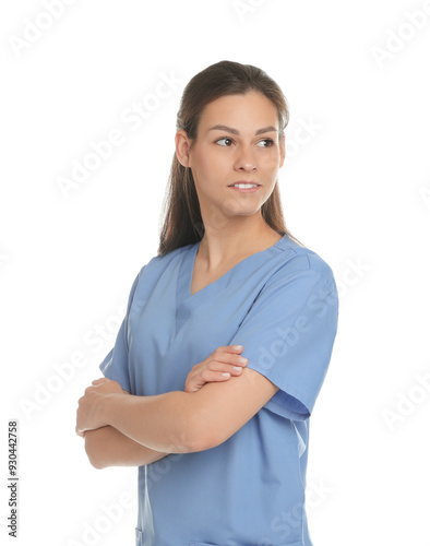 Portrait of beautiful nurse with crossed arms on white background