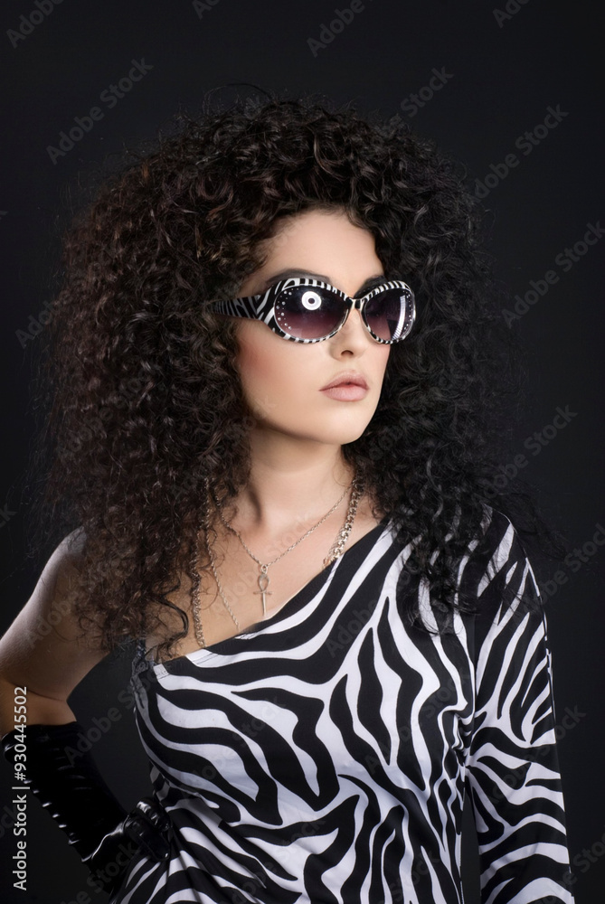 High fashion portrait of young elegant woman in black suit. High fashion portrait of young elegant woman in black suit.