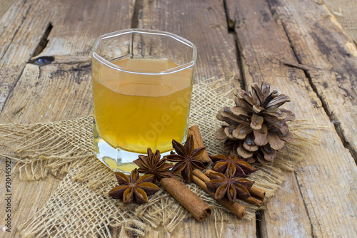 Apple juice, cinnamon sticks and anise stars photo