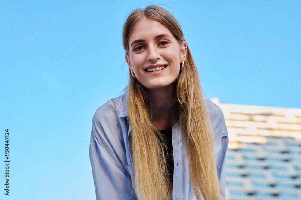 Portrait happy young beautiful girl blonde outdoors, blue sky background Portrait happy young beautiful girl blonde outdoors, blue sky background