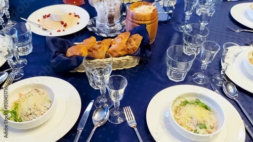  A beautifully set restaurant table showcases a variety of delicious dishes and drinks, inviting guests to enjoy a memorable dining experience