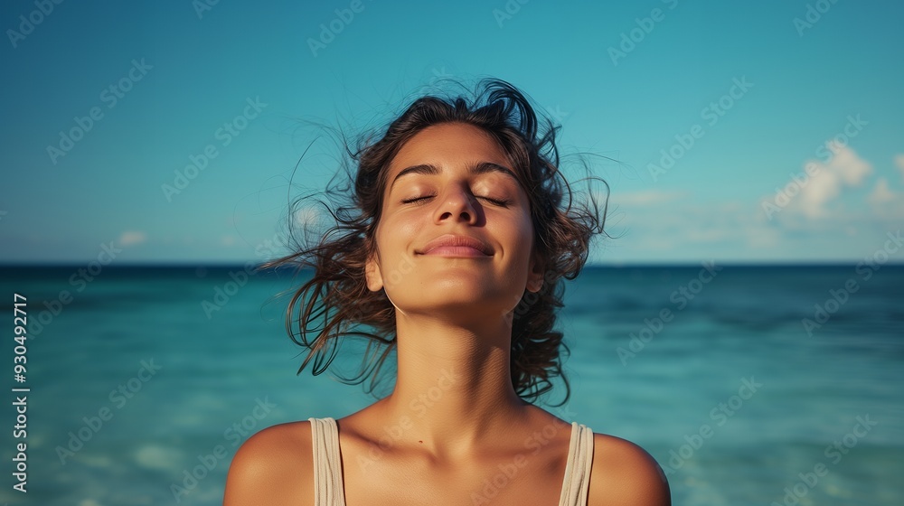 A serene woman enjoying the beach with a calm expression, embracing nature's beauty. A serene woman enjoying the beach with a calm expression, embracing nature's beauty.