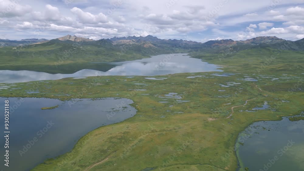 view of the andes mountain range surrounded by lagoons in the peruvian highlands view of the andes mountain range surrounded by lagoons in the peruvian highlands