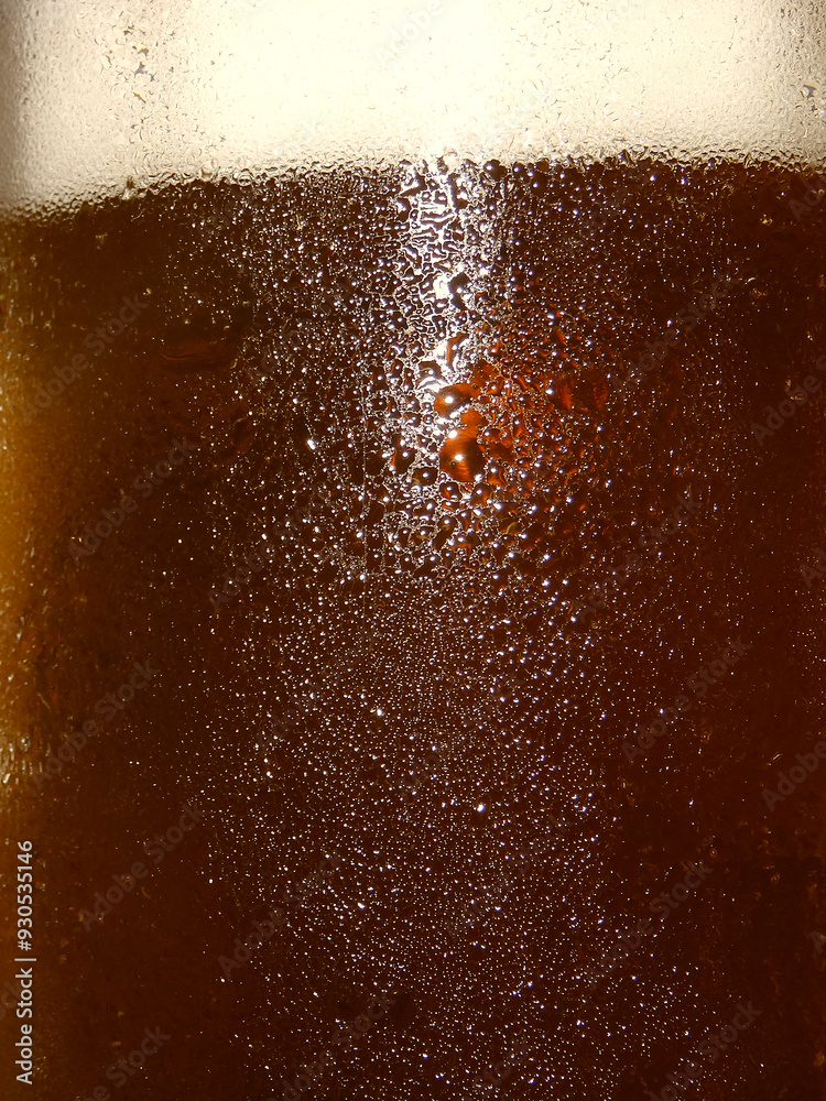 Reflections of light on the cold glass of a beer glass full of craft pale ale
Reflections of light on the cold glass of a beer glass full of craft pale ale