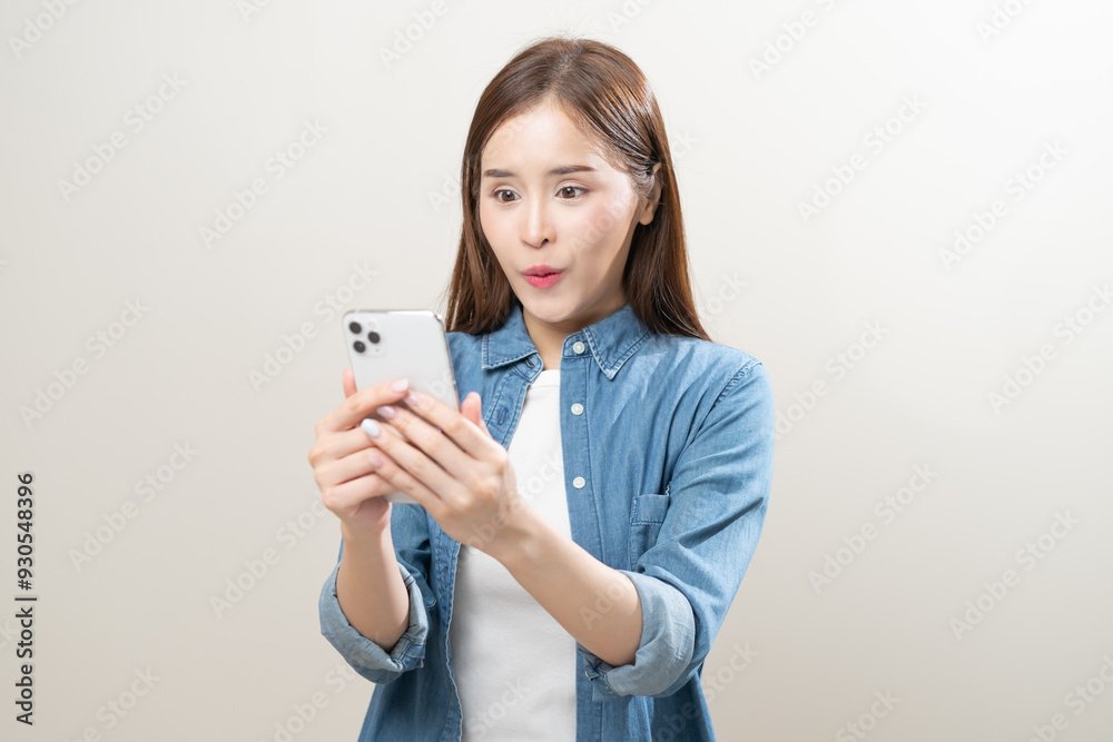 Happy asian young woman using mobile smart phone, read good news online, laugh excited getting offer, great positive surprise, celebrate success on smartphone. Smile girl isolated on white background. Happy asian young woman using mobile smart phone, read good news online, laugh excited getting offer, great positive surprise, celebrate success on smartphone. Smile girl isolated on white background.