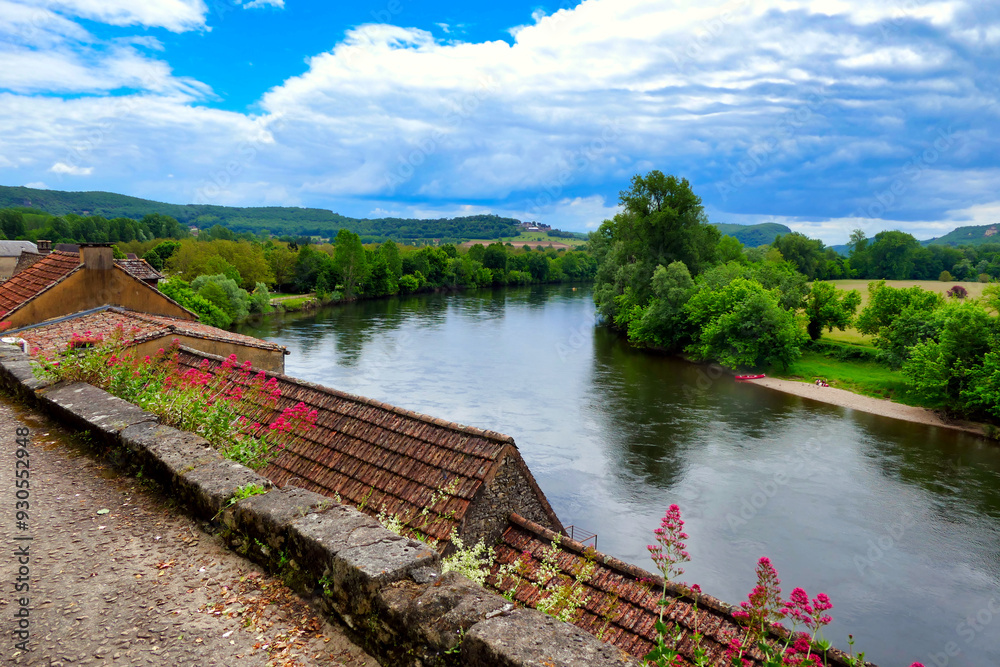 View of the River Dordogne flowing through the landscape as seen from Beynac et Cazenac a fortified town in the Dordogne, France
View of the River Dordogne flowing through the landscape as seen from Beynac et Cazenac a fortified town in the Dordogne, France