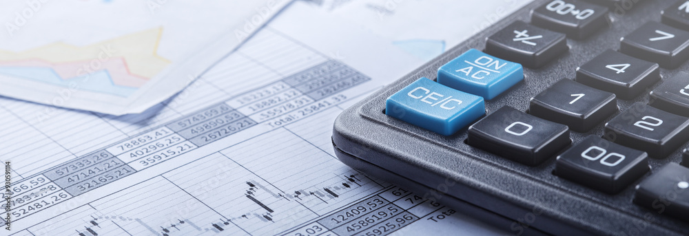 calculator and financial charts. Investment and capital accumulation concept calculator and financial charts. Investment and capital accumulation concept