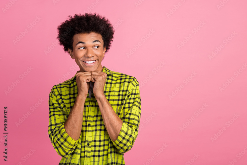 Portrait of nice young man look empty space wear shirt isolated on pink color background Portrait of nice young man look empty space wear shirt isolated on pink color background