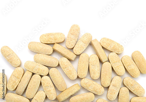 Yellow pills, medicine isolated on white background, top view