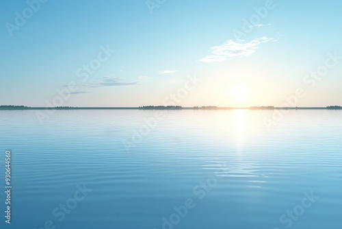 Serene lake landscape at sunset with calm water reflecting the sky