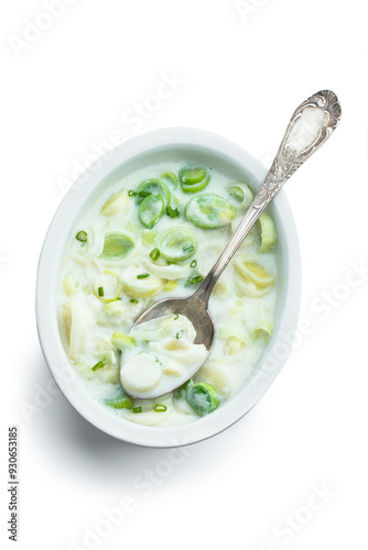 Buttered creamy leek in ceramic bowl isolated on white