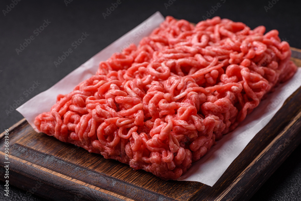 Fresh raw ground beef with salt and spices Fresh raw ground beef with salt and spices