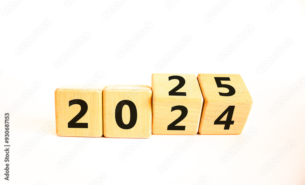 Business concept of 2025 new year symbol. Beautiful turned wooden cube and changed number 2024 to 2025. Beautiful white table white background, copy space. Business 2025 happy new year concept. Business concept of 2025 new year symbol. Beautiful turned wooden cube and changed number 2024 to 2025. Beautiful white table white background, copy space. Business 2025 happy new year concept.