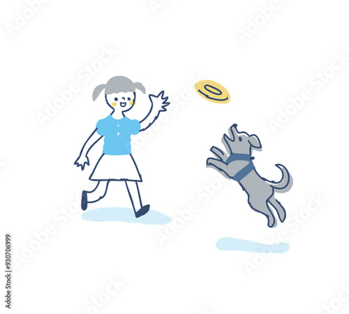 フリスビーで遊ぶ犬と女の子