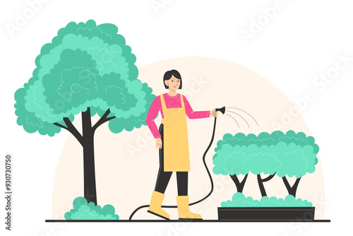 A young woman is watering the bushes in the garden