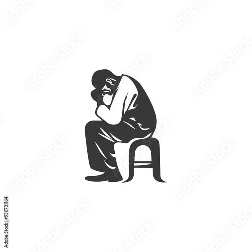 Depressed man sitting on a stool with his head in his hands