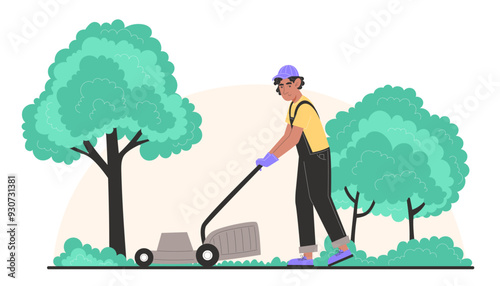 A young man mows the lawn with a lawnmower