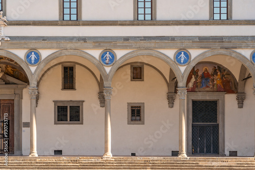 Ospedale degli Innocenti’s loggia with Della Robbia medallions and fresco in Piazza della Santissima Annunziata