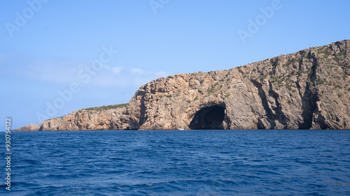 Panoramic view of rocky coastline entering the water of southern Sardinia, Italy, near Masua with clear turquoise waters near Porto Flavia