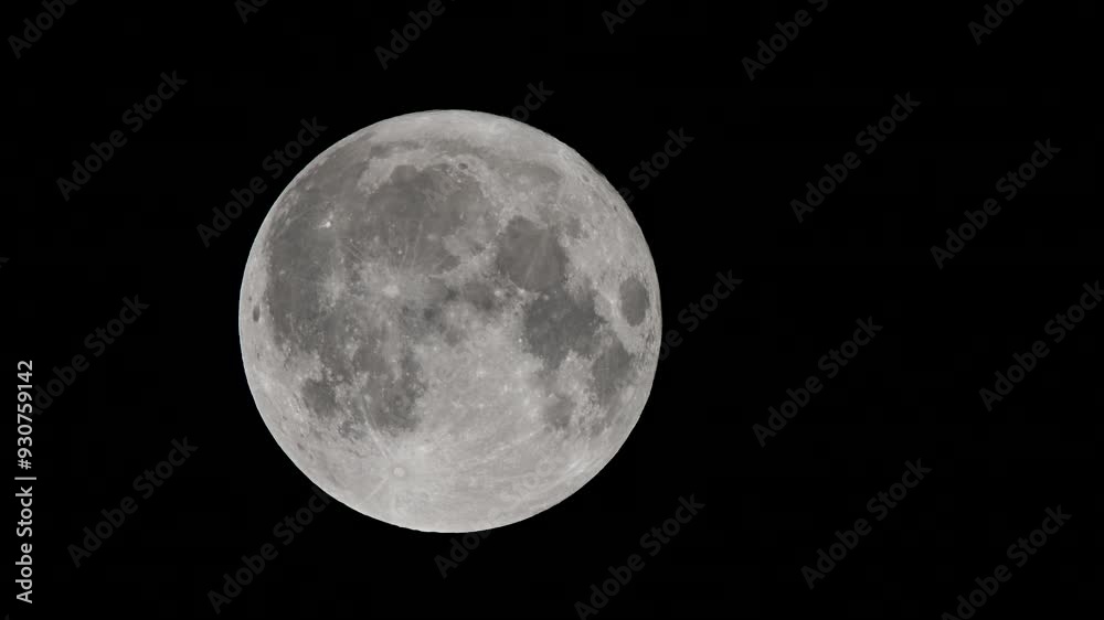 Full moon against a black night sky. Close-up of the full moon illuminated against a pitch-black night sky, showcasing lunar surface details and craters. Full moon against a black night sky. Close-up of the full moon illuminated against a pitch-black night sky, showcasing lunar surface details and craters.