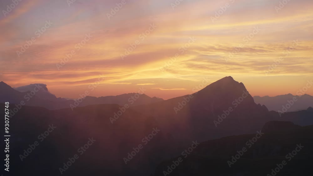 Beautiful sky with low hanging clouds during a sunset in the Dolomites, Italy. Beautiful sky with low hanging clouds during a sunset in the Dolomites, Italy.