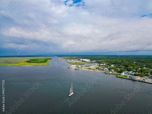 Above sailboat returning to port