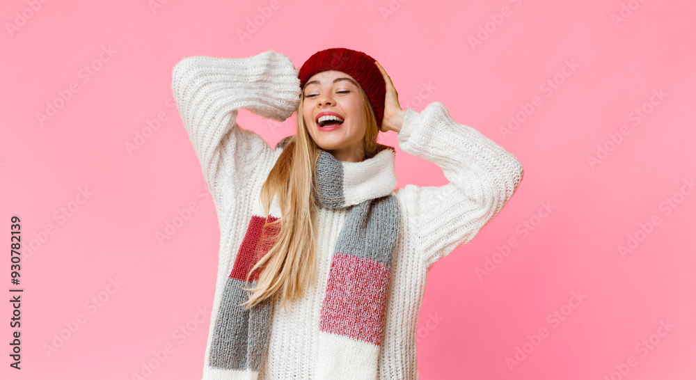 Carefree joyful girl in colorful knitted winter set over yellow studio background, holding hands behind head Carefree joyful girl in colorful knitted winter set over yellow studio background, holding hands behind head