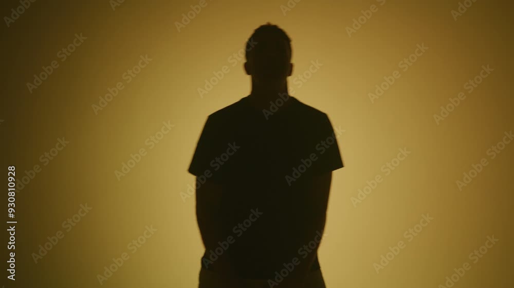 Rap artist singing for a music video on a color changing background Rap artist singing for a music video on a color changing background
