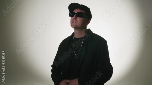 Rap artist singing for a music video on a white background