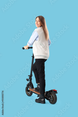 Young businesswoman riding ...