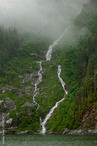 waterfall splitting into two falls and then combining into one in alaska